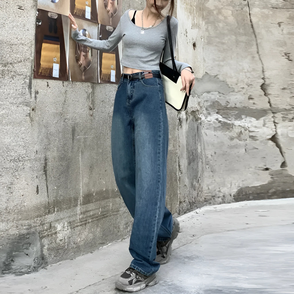 Women's retro blue high-waisted straight-leg jeans on a hanger, showing front detail.