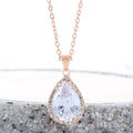 Rose gold water drop shape necklace with rhinestone geometric detailing in pink colour