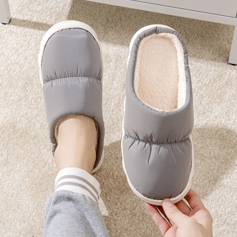 Pair of thick-soled winter slippers with artificial leather upper and plush lining, shown in a choice of colours.