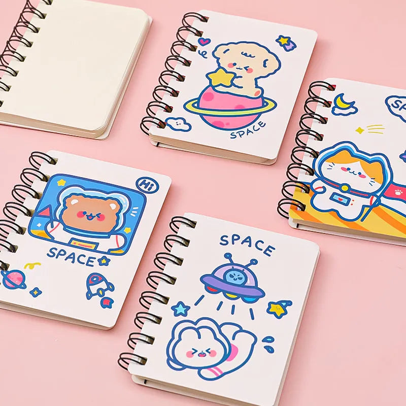 Astronaut-themed flipper notebook measuring 10.5cm by 8cm with space design cover options