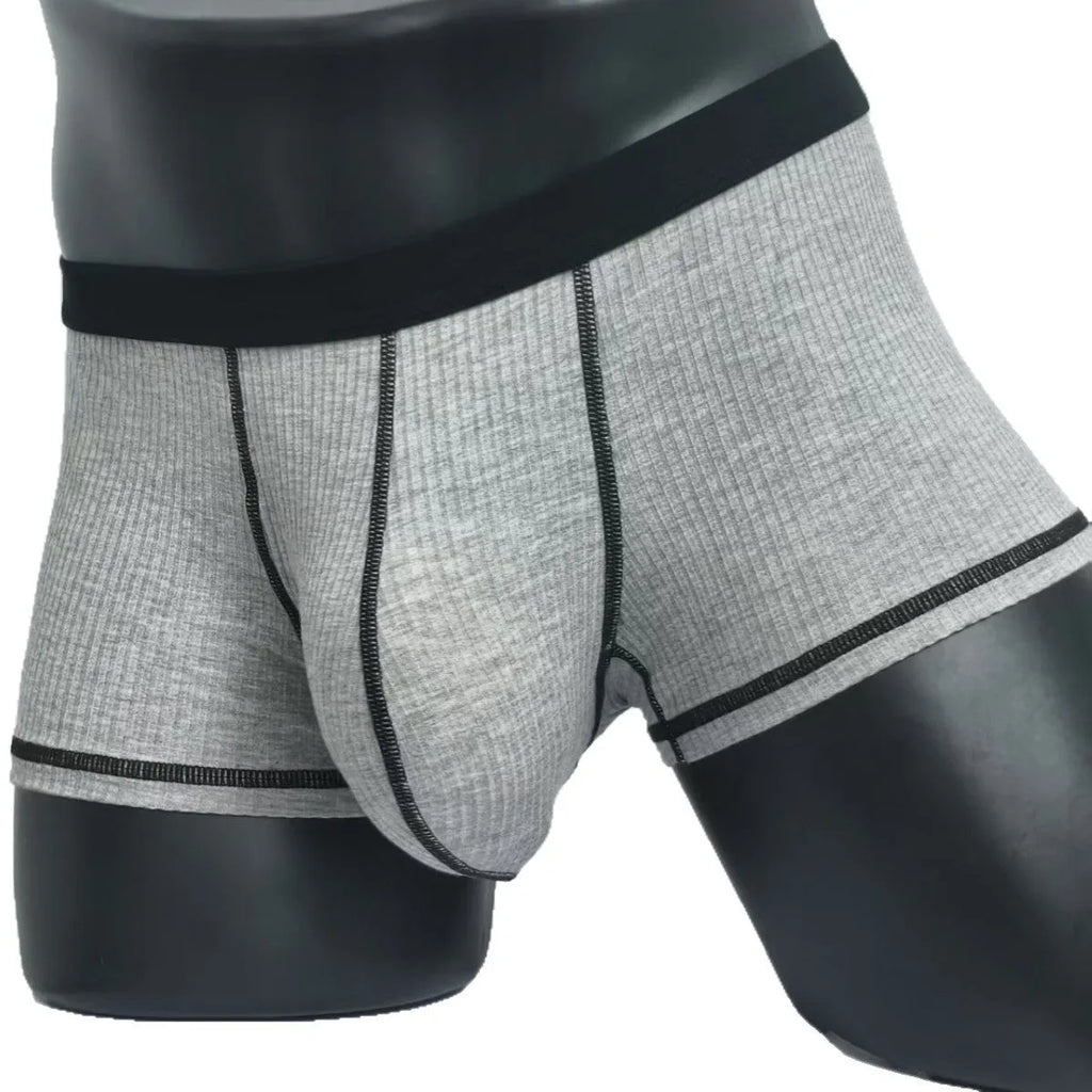 Men's slim-fit breathable boxer shorts in solid colours, shown in size range L to 3XL.
