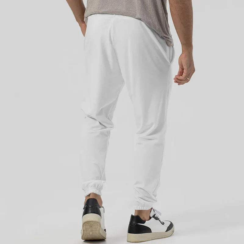 Men's gray elastic track sweatpants with straight-leg tapered design and mid waist