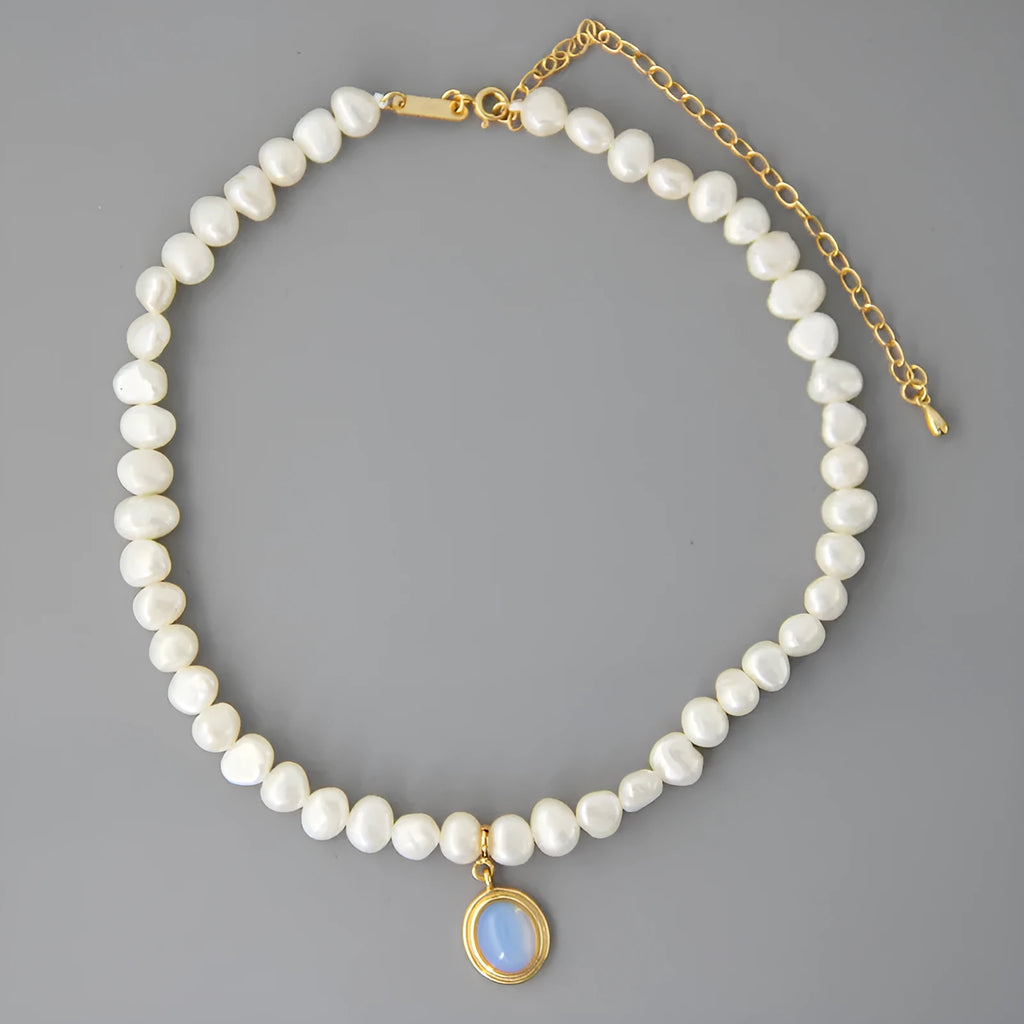 Round medal pearl necklace with geometric silver pendant and irregular freshwater pearls