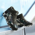 Green camouflage canvas women's sneakers with increased sole height and lace-up design