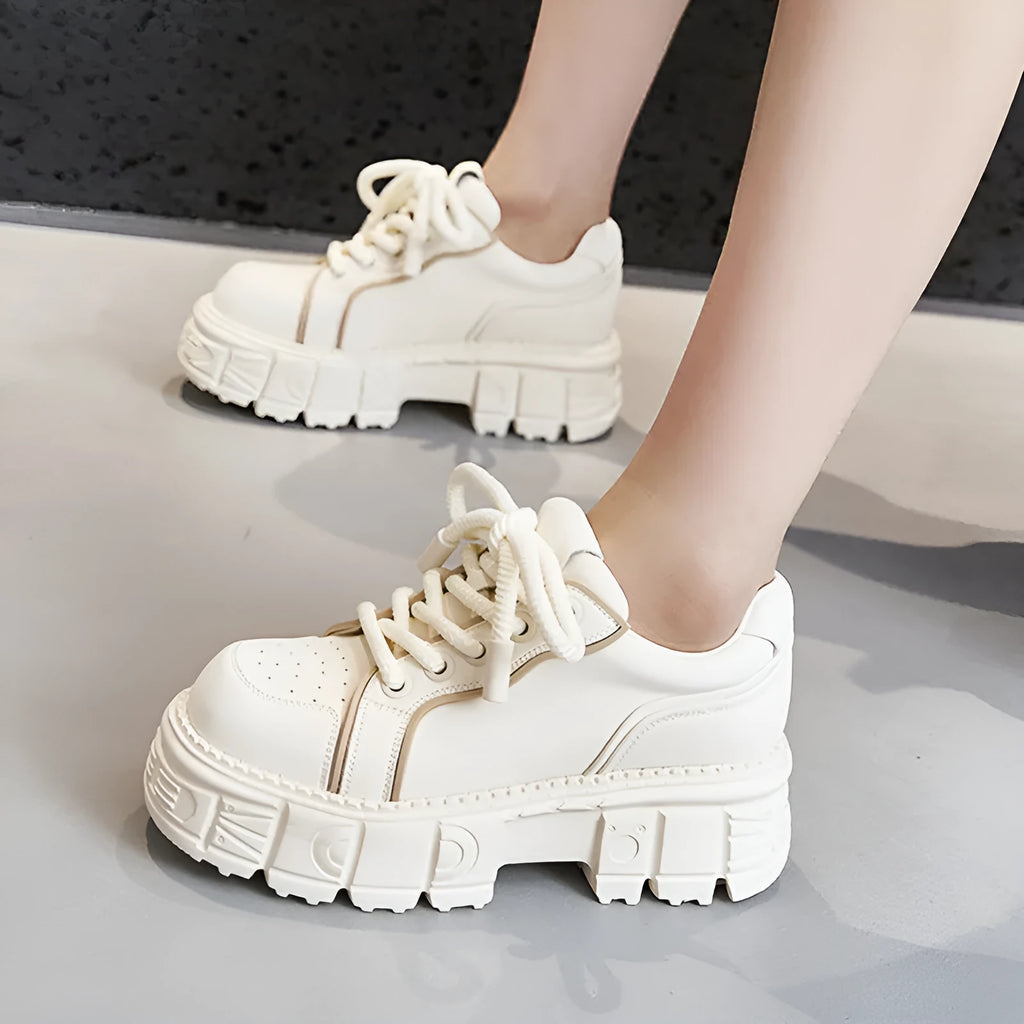 Women's beige muffin bottom leather casual shoes with wedge heel on white background