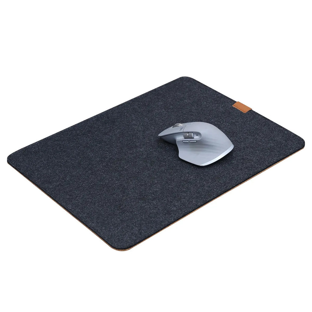 Oversized black grey felt and cork mouse mat on office desk with non-slip backing