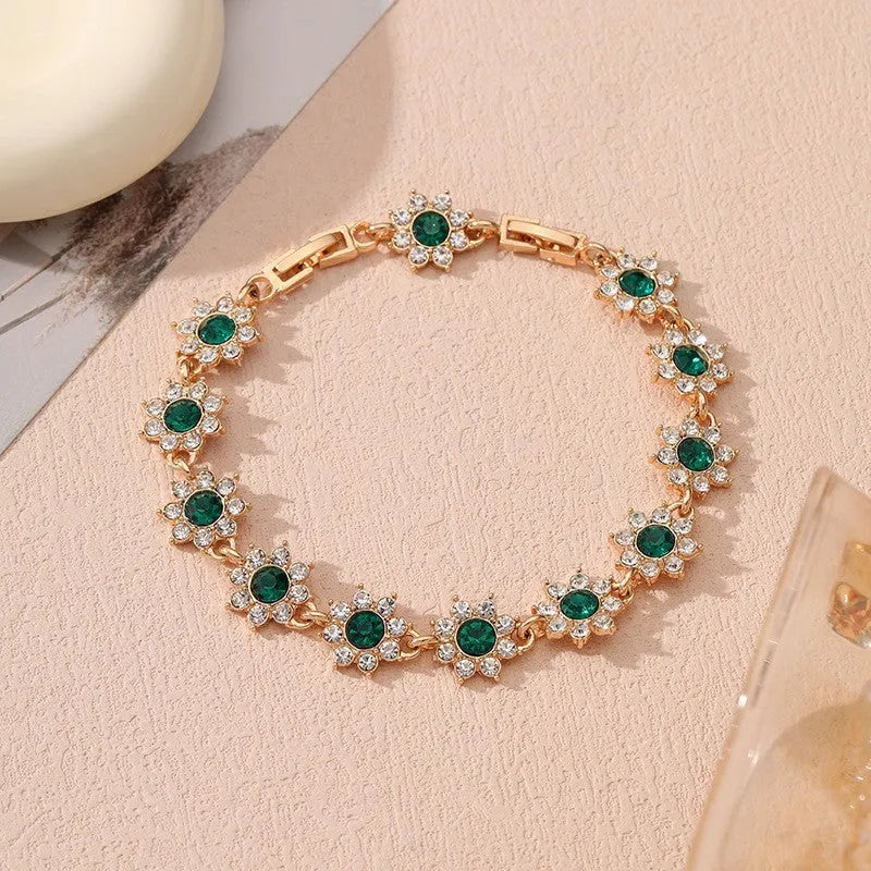 Zinc alloy flower bracelet with electroplated colour finish and colourful crystal decorations in gold and silver variations