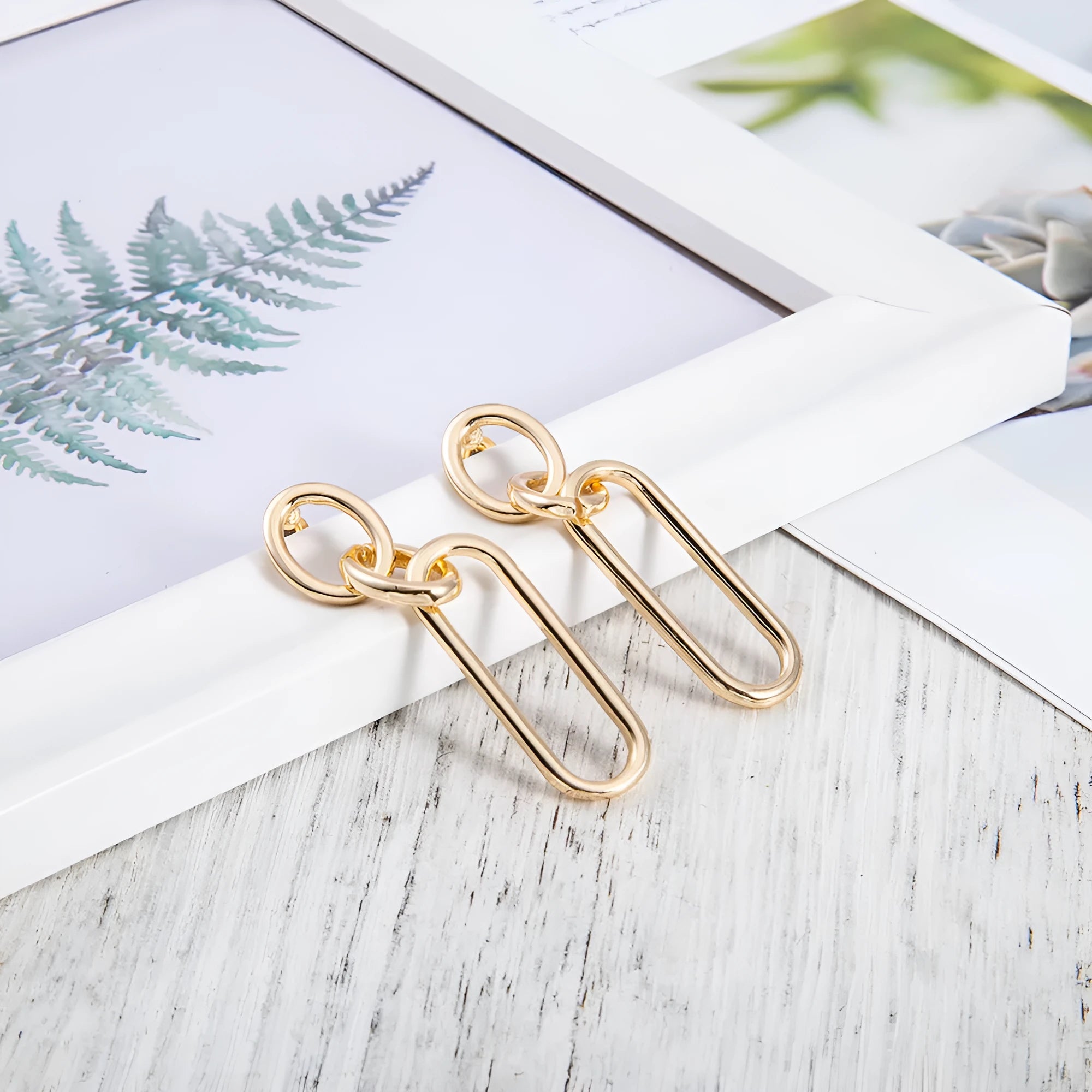 Sterling silver geometric hoop earrings for women with ring and line design elements