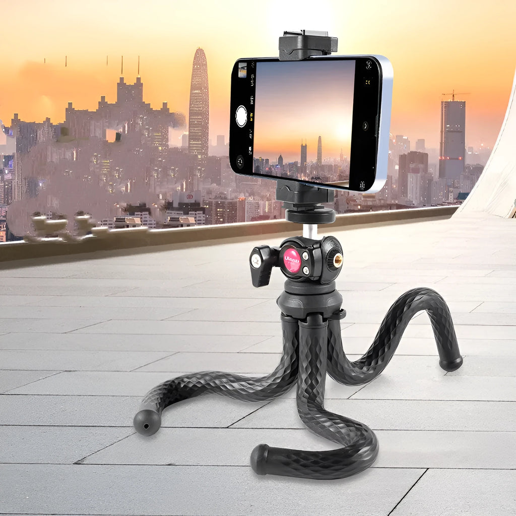 Black octopus leg tripod with extended aluminium shaft and attached mobile phone clip