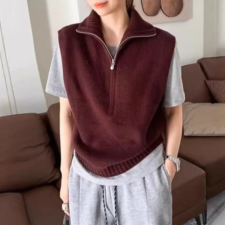 Women's sleeveless half-zip knit vest in mesh fabric, shown in a solid colour with a 3D pattern.