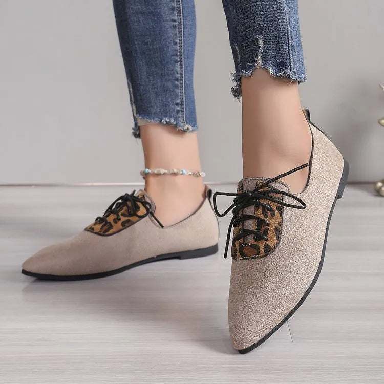 Beige leopard print pointed toe pumps for women with a block heel, shown in a plus size.