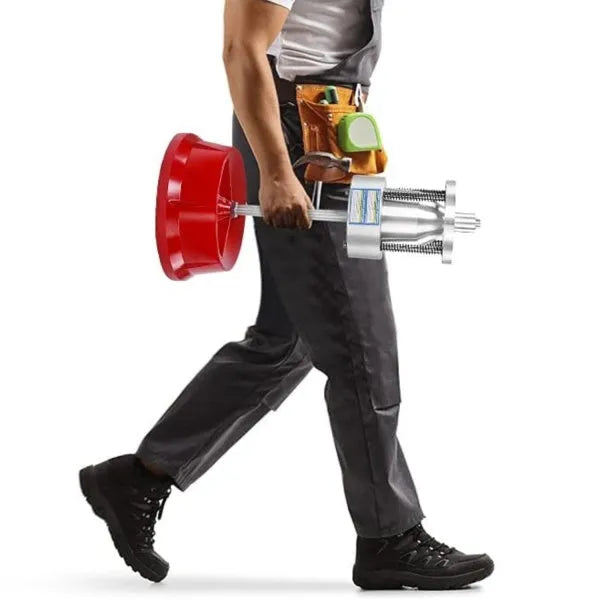 Portable aluminium hub balancer with bull's eye level on a red enamel-finished base.