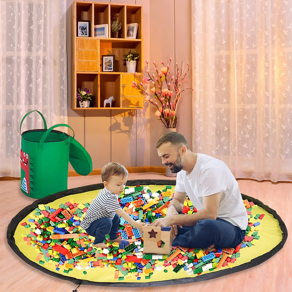 Green cube-shaped felt storage bag with pull rope lying flat as a play mat.