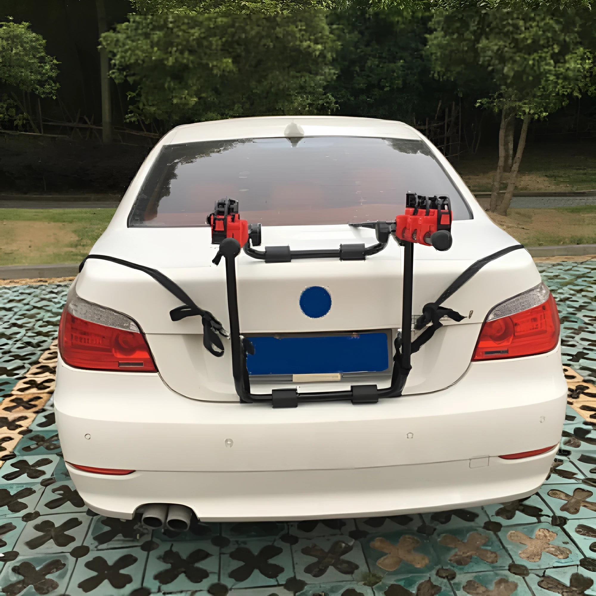 Black and red car boot mounted bicycle rack with protective sponge padding