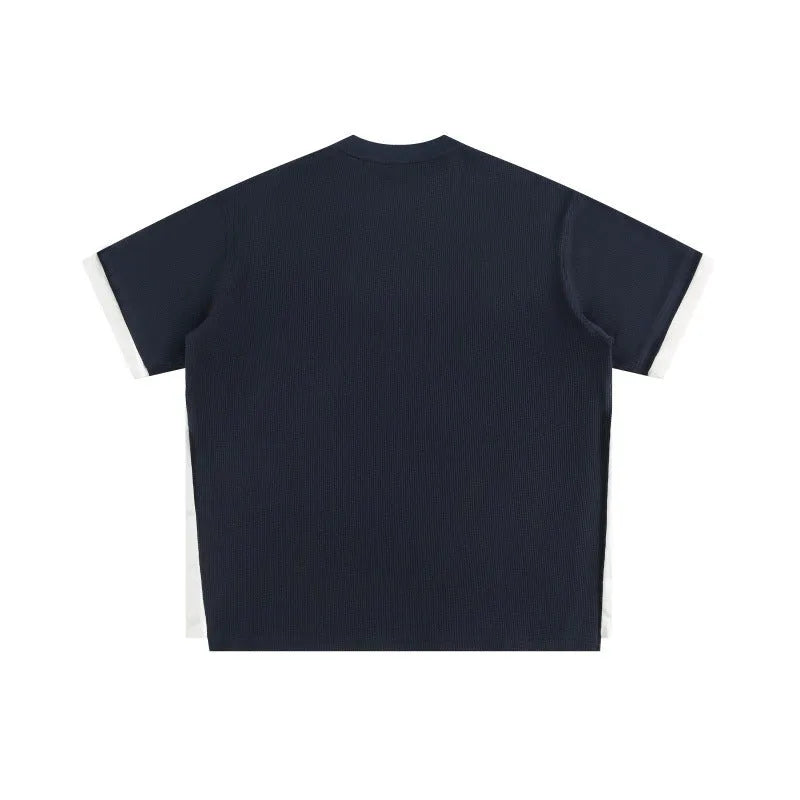 Retro alphabet embroidered loose waffle knit short-sleeved t-shirt in navy blue.