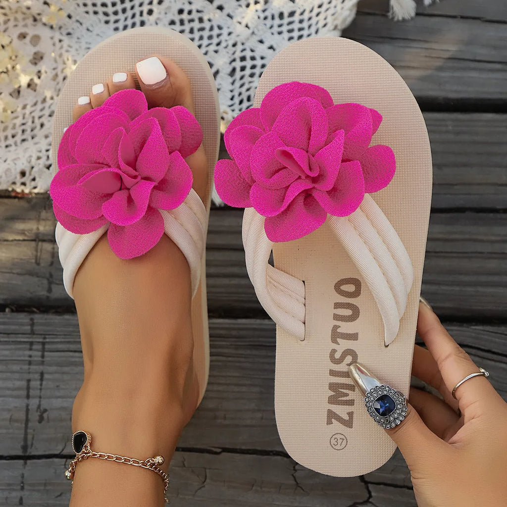 Plus size floral slipper in solid colour with round toe and flip flop style.