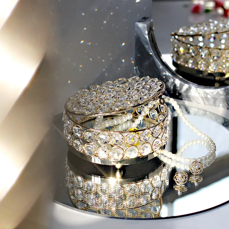 Crystal glass jewellery box with transparent sides and a French gold metal frame.