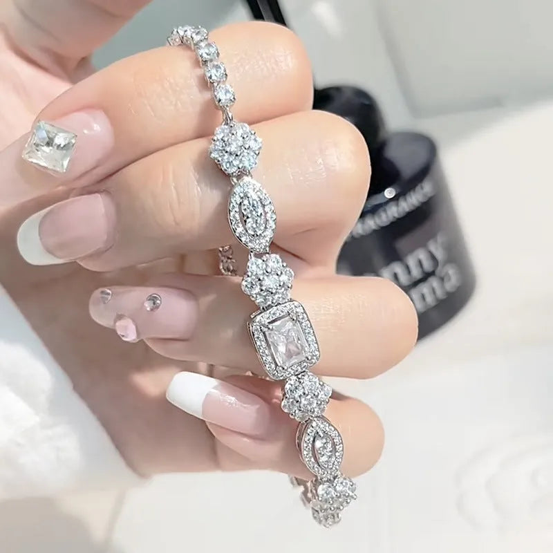 Women's white gold plated geometric bracelet with zircon stones in two length options.