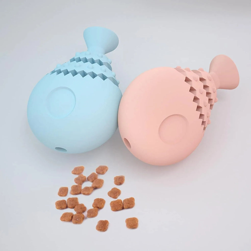 Blue fish bone shaped silicone dog chew toy with a treat hole, shown next to a green and pink version.