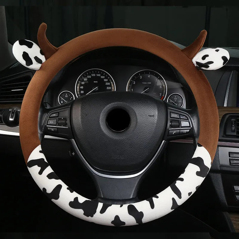Short plush automotive steering wheel cover in black colour showing textured surface