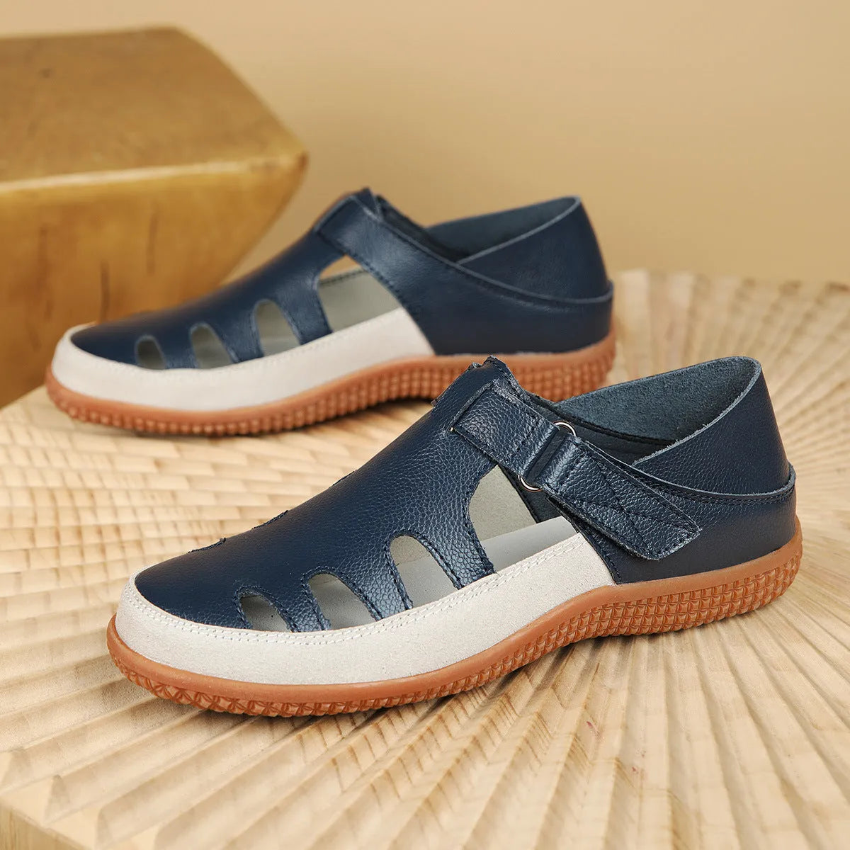 Plus size women's flat heel sandals with hollow toe cap in blue colour showing rubber sole