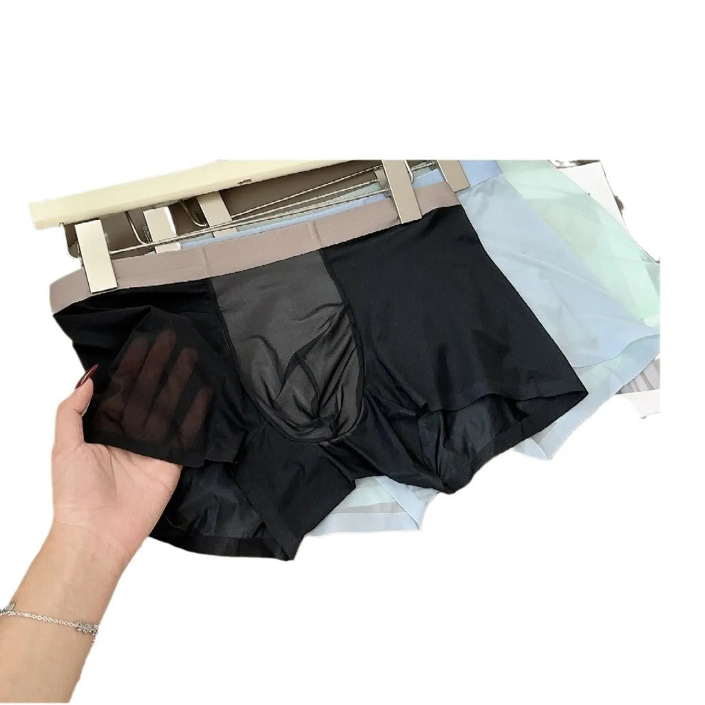 Seamless men's boxers in black Ice Silk Nylon fabric showing the honeycomb crotch and mid-waist design.