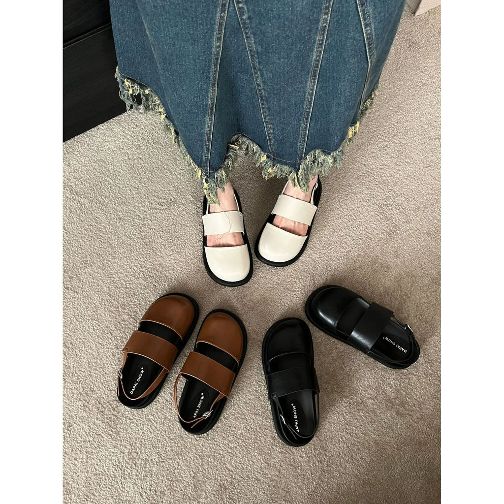 Retro style closed toe sandals with a single ankle buckle strap in apricot colour.