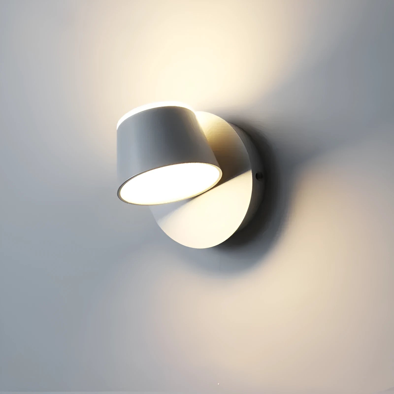 Simple LED wall lamp with stainless steel body and acrylic shade for bedside or sofa use