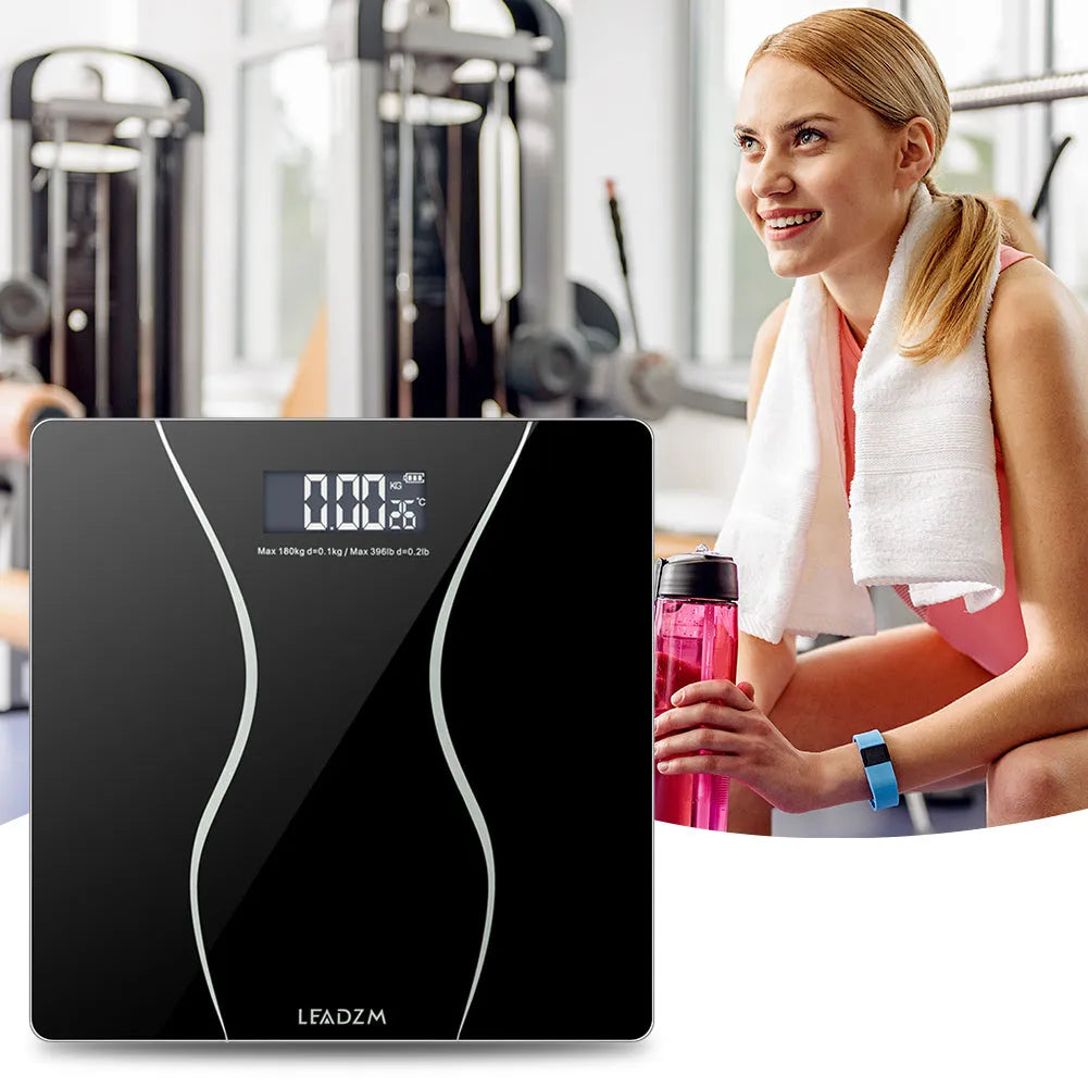 Black electronic bathroom scale with digital display and 180kg capacity