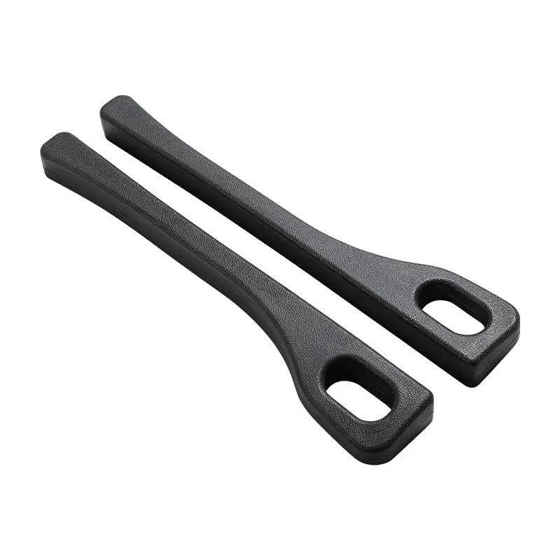 Flexible polyurethane car seat gap strip in black colour lying next to a car seat.