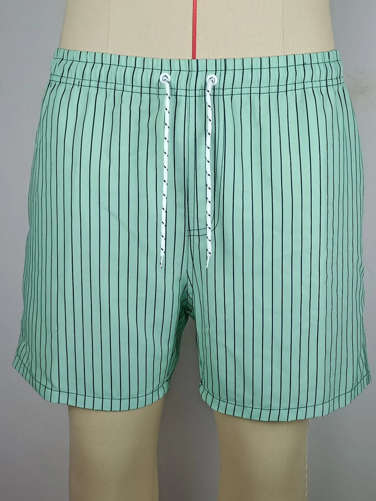 Polyester fibre striped beach shorts with straight leg opening and triangle lining design in multiple colours