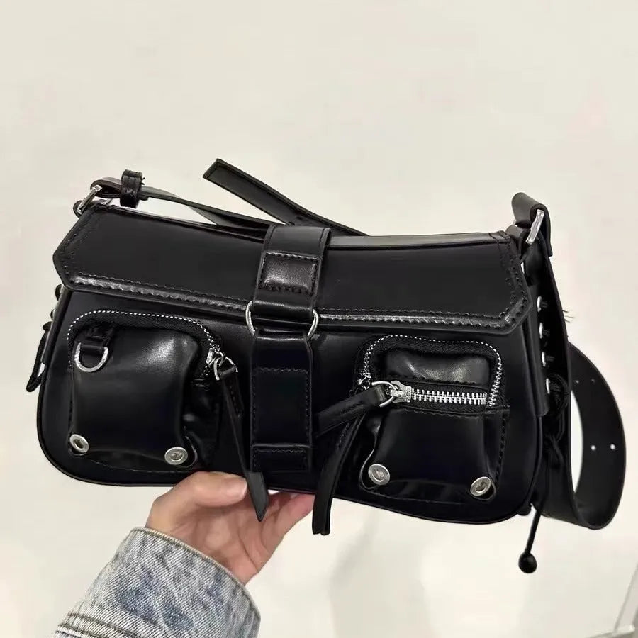 Black PU leather underarm baguette bag with adjustable shoulder strap shown in crossbody position