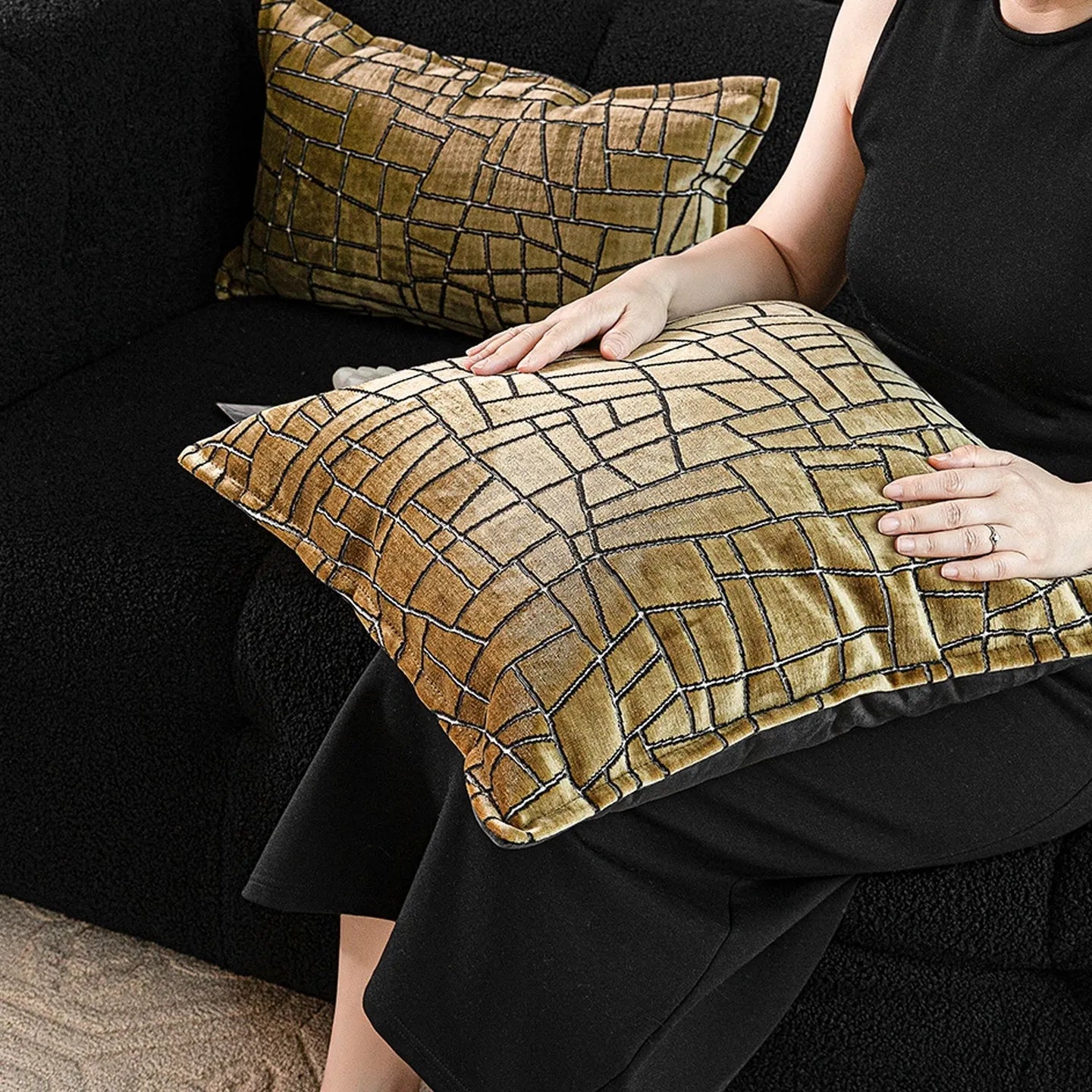 Tuhao gold geometric abstract pattern on a square decorative cushion with tassel detail.