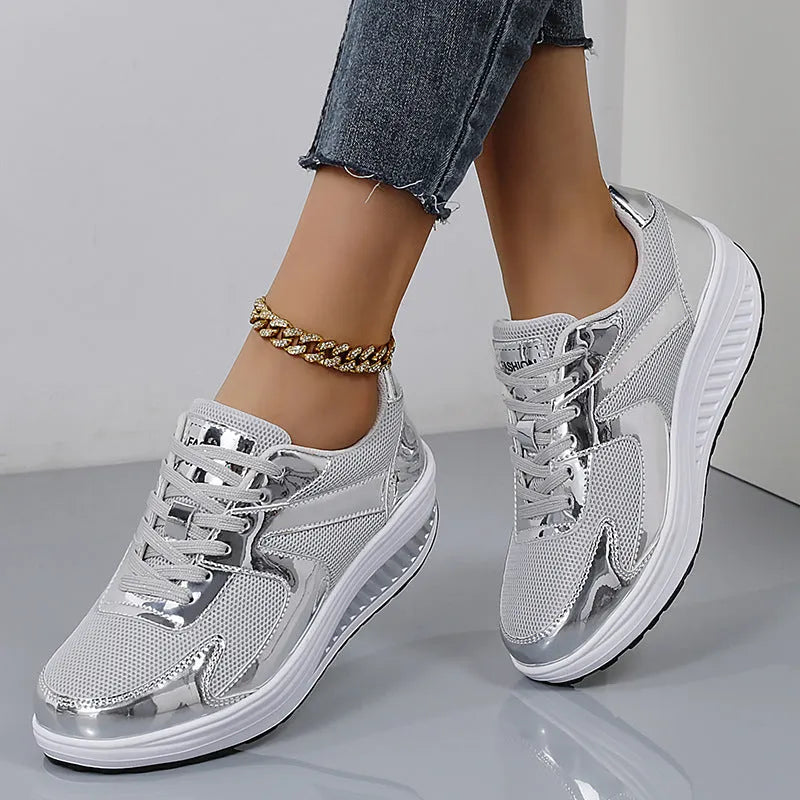 Women's gold platform trainers with mesh upper, cross-strap design and waterproof platform
