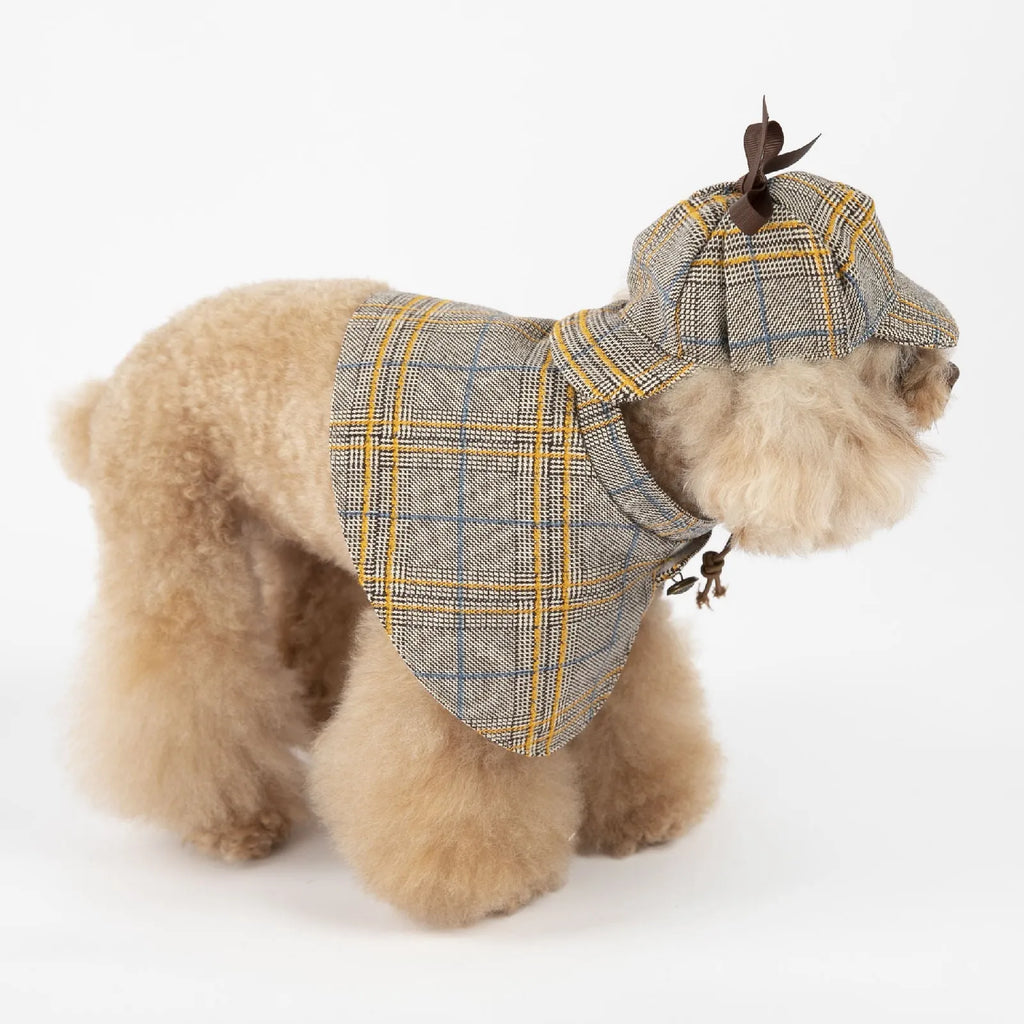 Camel-coloured cotton detective suit cloak for a small dog on a neutral background.
