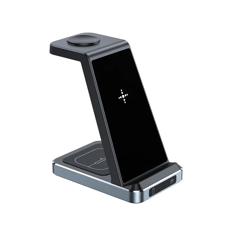 Three-in-one wireless charger in black with phone, watch, and earbuds placed on charging zones