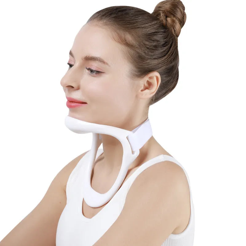 White PP plastic neck and shoulder support brace for posture correction on a grey background.