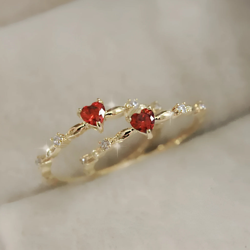 Gold or silver electroplated copper ring with a peach heart shape set with zircon stones.