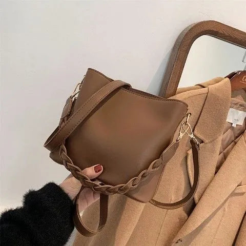 Retro woven PU bucket bag in khaki colour shown as crossbody and underarm bag