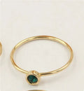 14K gold-plated GF zircon knuckle ring on finger in green colour