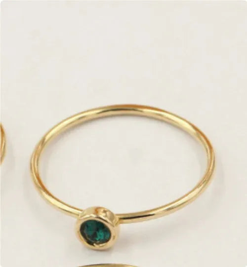 14K gold-plated GF zircon knuckle ring on finger in green colour