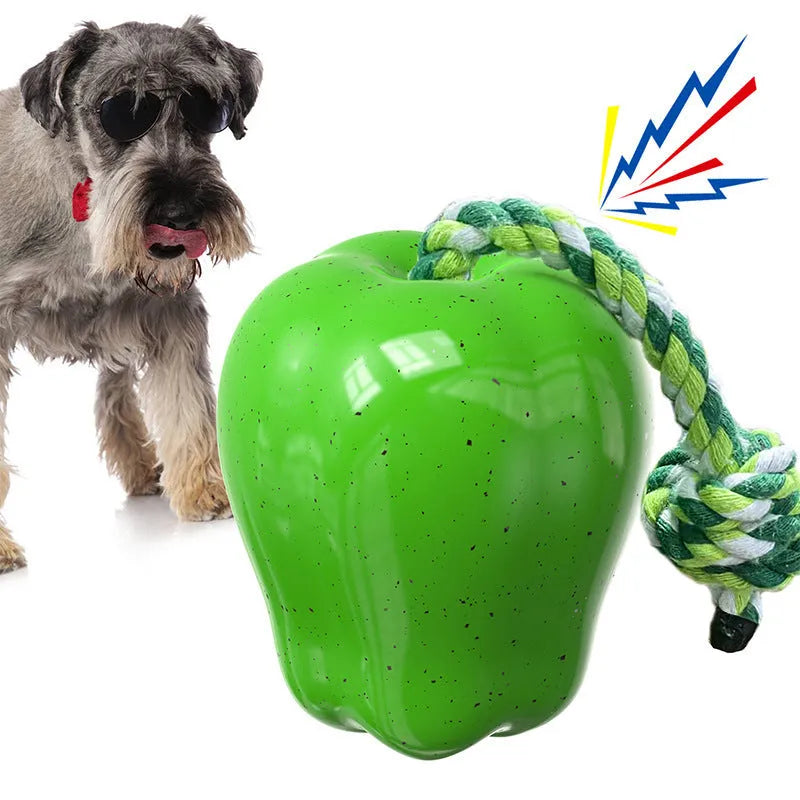 Green apple-shaped plastic dog chew toy with treat-dispensing opening