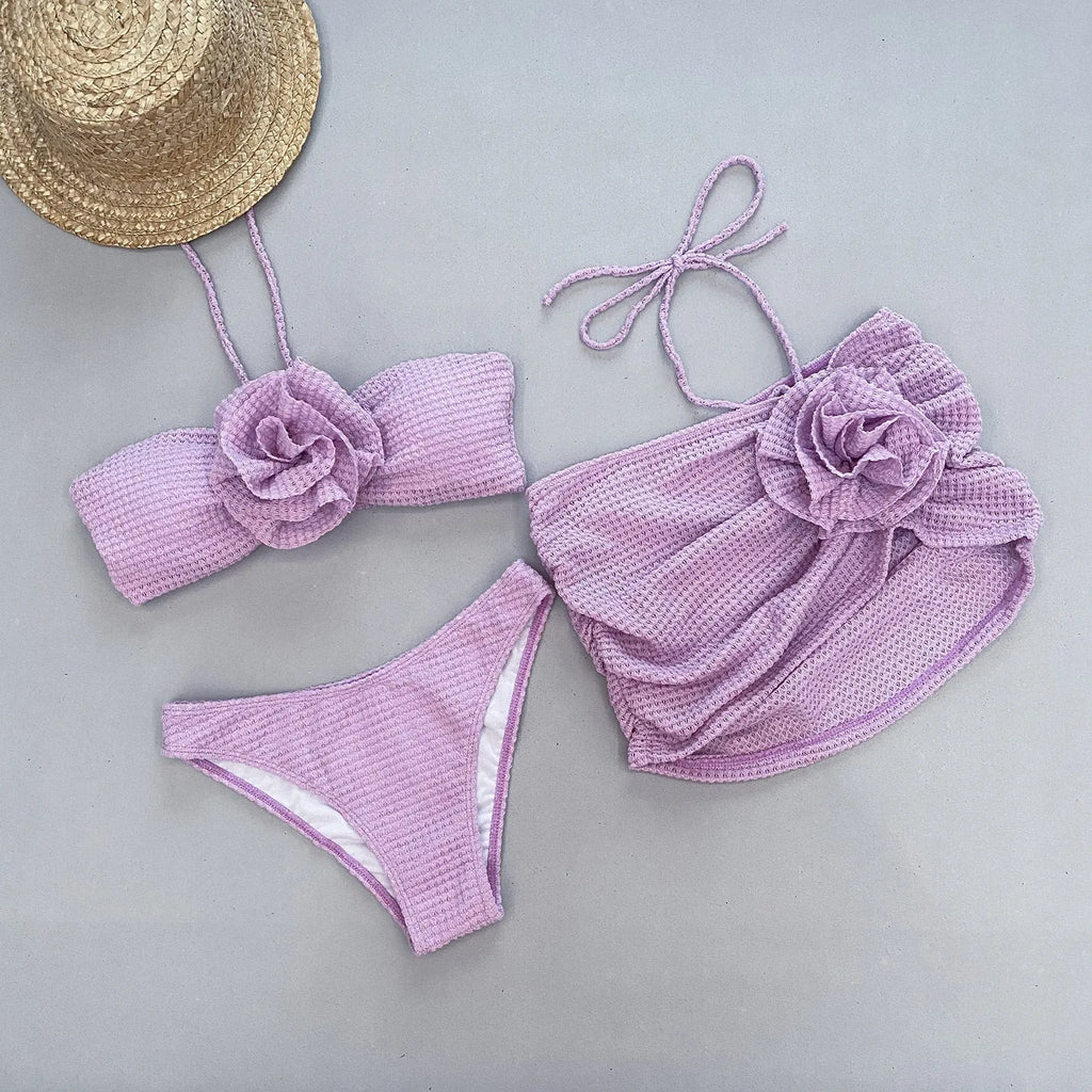 Women's three-piece bikini swimsuit set in white or purple with skirt, bra, and briefs