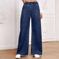 Light blue washed wide-leg denim trousers for plus size figures with mid waist and straight leg silhouette