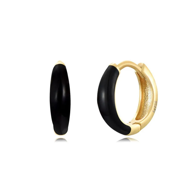 Geometric U-shaped epoxy earrings with a dripping oil finish in various colours.