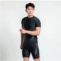 Men's two-piece polyester swim set showing short-sleeved swim top and matching trunks on a hanger.