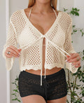 Short women's cardigan blouse with bell sleeves in hollow woven imitation cotton fabric.