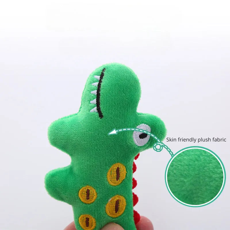 Colourful plush cat toy shaped like a cow, a crocodile, or a parrot on a plain background.