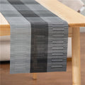 Non-slip PVC place mat in modern simple style, showing gradient bamboo black colour option on a kitchen counter.