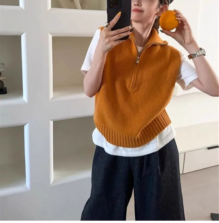Women's sleeveless half-zip knit vest in mesh fabric, shown in a solid colour with a 3D pattern.